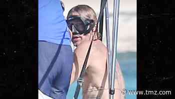 Brad Pitt's Tatted Up and Snorkeling for Island Vacay