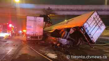 Man critically injured after 2 tractor trailers collide on Highway 401 in Toronto