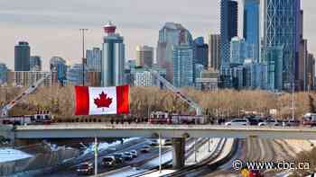 Thousands line route as Calgary police escort body of slain officer to funeral home