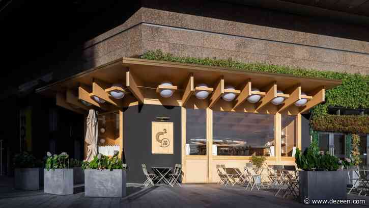 Various Associates designs C2 Cafe & Bar as a wooden "cabin in the city"