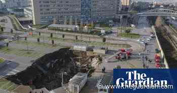 Drone footage shows huge sinkhole in Naples hospital car park – video