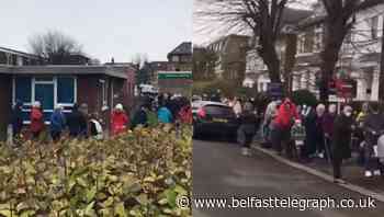 Queue winds around corners in south London as GPs roll out vaccine