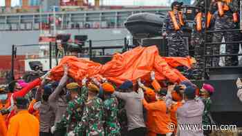 Black boxes located at Indonesian airliner crash site as human remains recovered