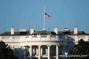 The Latest: Trump Orders US Flags Lowered to Honor Officers