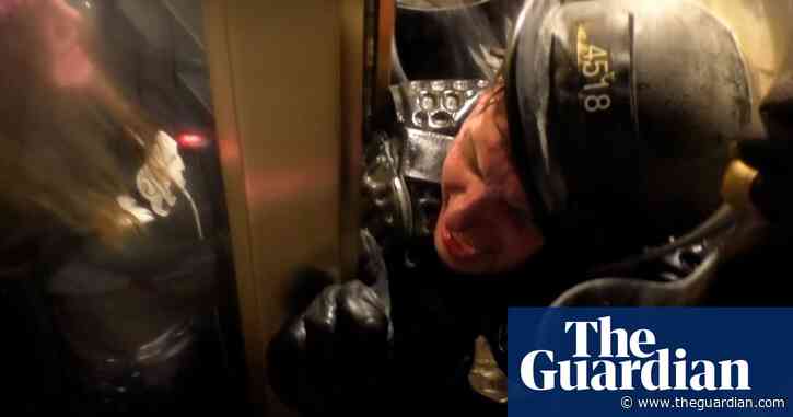 Police officer crushed in doorway by rioters during Capitol breach – video