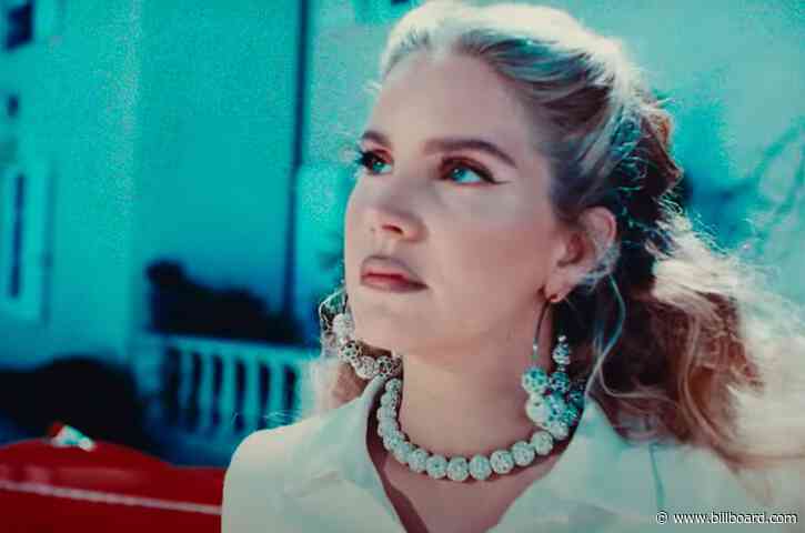 Lana Del Rey Indulges in Whimsically Wicked Transformation in ‘Chemtrails Over the Country Club’ Video