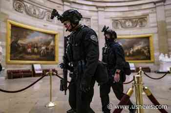 The Latest: Firefighter Photographed in Capitol Is Charged