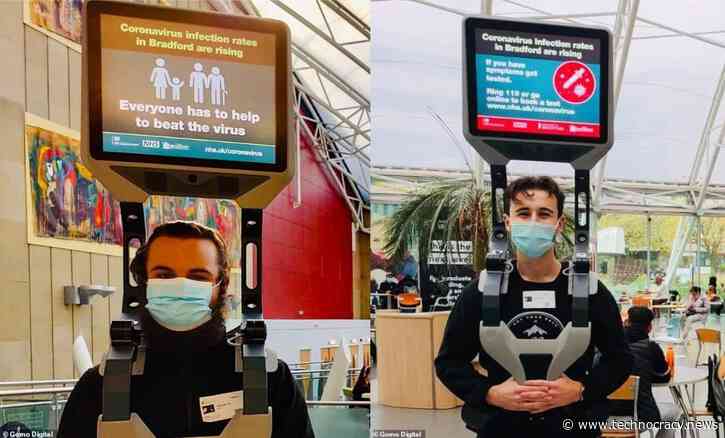 UK Gov’t Hires Men To Stand In Public With TV On Head For Pandemic Propaganda