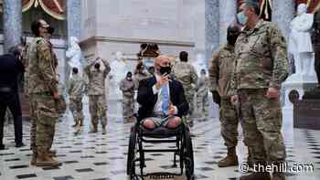 Republican war veteran gives Guard troops a tour of the Capitol
