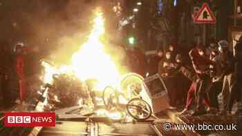 Belgian king's car hit during riots over death in police custody