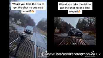 TikTok video shows car being photographed in middle of The Oaks level crossing, Bromley Cross