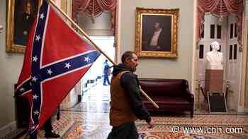 Man carrying Confederate flag inside the US Capitol during riot arrested, identified as Kevin Seefried