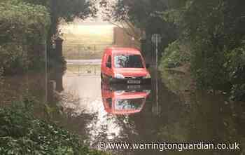 Postman's van stranded in floodwater at Chaigeley School