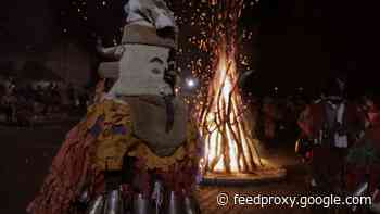 Bulgarian villagers chase away evil with bonfire feast and dancing