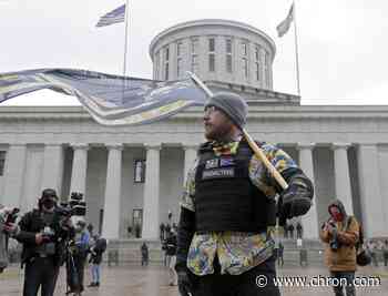 Heavy fortified statehouses around the US see small protests