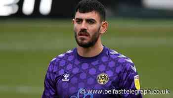 Newport keeper Tom King scores from goal kick against Cheltenham