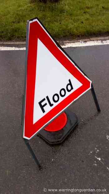 Two people rescued from car stuck in flood water in Winwick