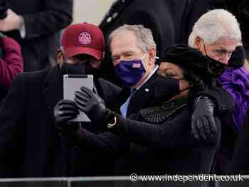 Bill Clinton photobombs George Bush as US leaders take selfies at Biden inauguration