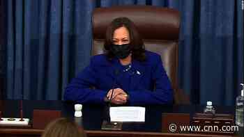 A proud Harris smiles as she swears in new senators in her new role