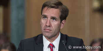 Photo captures uniformed person kneeling at Beau Biden’s grave while dad is sworn in