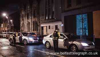 Police revisit the scene of racist arson attack on Belfast Multi-Cultural Association premises