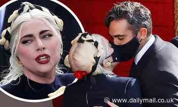Lady Gaga is seen KISSING tech entrepreneur Michael Polansky through MASKS - Daily Mail