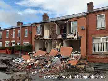 Homes collapse and residents evacuated after sink hole appears in street