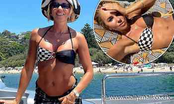 Pip Edwards shows off figure in bikini during beach day out with boyfriend Michael Clarke