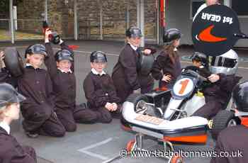 Bolton pupils were Lewis Hamilton's pit crew for a day