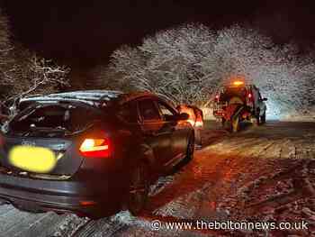 Driver rescued after car gets stuck on icy road on moors near Entwistle Reservoir