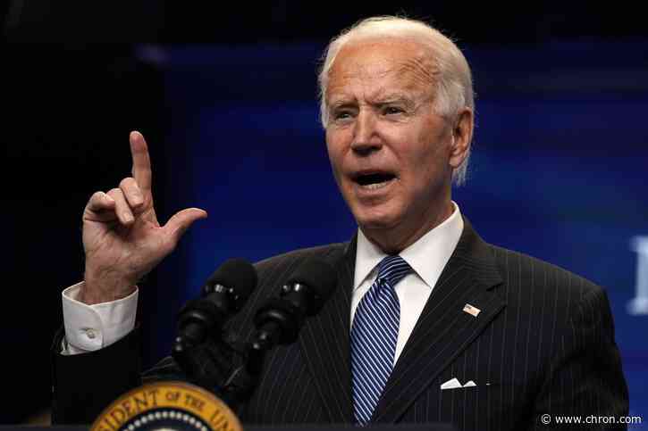 Signing 'Buy American' order, Biden pushes for urgent relief