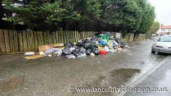 Blackburn flats bin stand-off saw pile of festering of rubbish build up