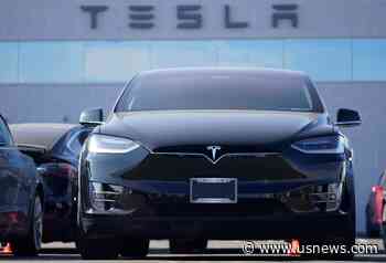 Tesla Posts 1st Annual Profit but Misses Analysts' Estimates