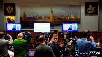 Russia detains Navalny's allies, warns social networks