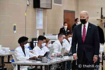Biden makes first visit to wounded service members at Walter Reed as president