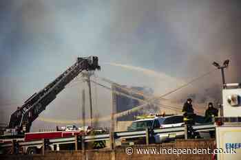 Crews battle flames, cold, wind in huge recycling plant fire