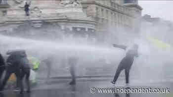 Paris protesters blasted with water canons by French police