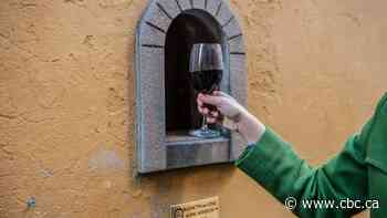 Centuries-old wine windows in Florence put a novel spin on physical distancing