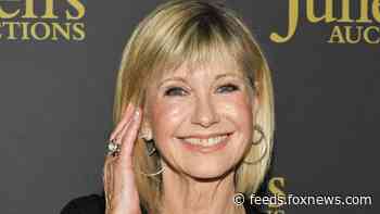 ‘Grease’ star Olivia Newton-John details first kiss with John Travolta: ‘It was a beautiful day’