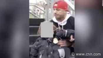 Man charged with attacking officer who suffered concussion in US Capitol riot