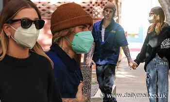 Justin Bieber holds hands with wife Hailey as they enjoy a late lunch