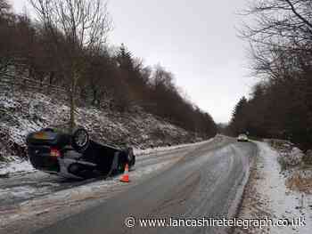 Car flips onto roof in Grane Road smash as heavy snow causes morning chaos