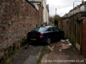Mystery over abandoned car stuck between two walls in Darwen back alley