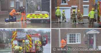 Emergency services help to clear away floods as water reaches homes