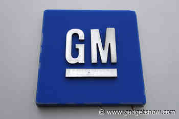 GM hit by chip shortage, to cut production at four plants