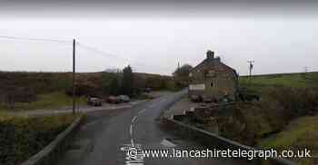 Major Darwen road closed after car crashes into dry stone wall and flips onto roof