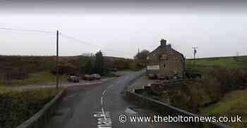 Major road closed near Edgworth after car crashes into dry stone wall and flips onto roof