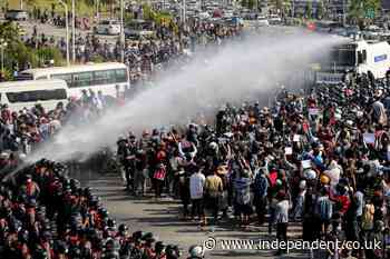 Myanmar police fire water cannon amid largest protests in over a decade
