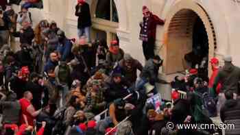 Democrats begin impeachment trial with stunning riot video