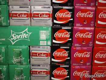 Coca-Cola rises as sales inch back